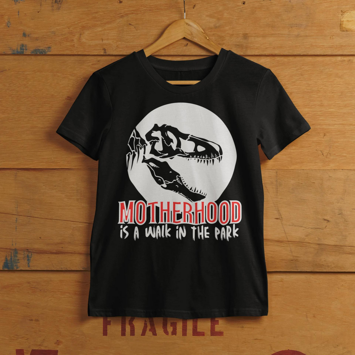 t-shirt, dinosaur, motherhood, parenting, family, mom life, comfortable, graphic design, mother's day, gift for mom, soft fabric, empowering phrase, casual style, strength, adventure, mom pride, chic, quality, lasting impression, cute design, love, grace, fashion, motherhood is a walk in the park tee