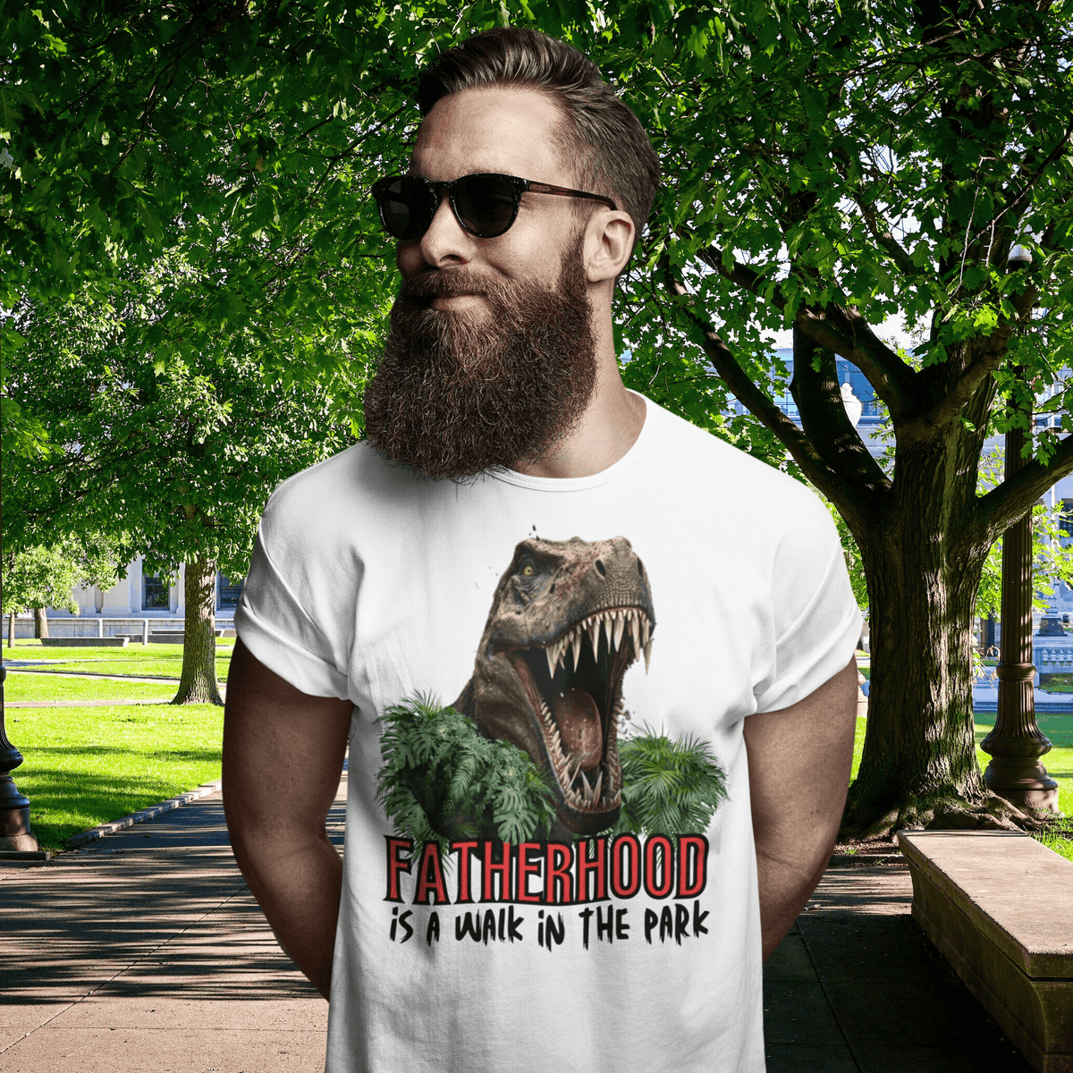 dinosaur, fatherhood, parenting, family, dad life, t-shirt, casual wear, graphic tee, father's day, gift for dad, comfortable, playful design, soft fabric, unique phrase, conversation starter, prehistoric, adventure, dad pride, comfort, stylish, fun, dad fashion, fatherhood is a walk in the park tee