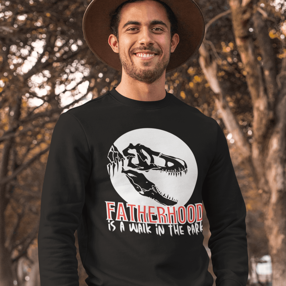 sweatshirt, dinosaur, fatherhood, parenting, family, dad life, cozy wear, graphic design, father's day, gift for dad, comfortable, unique phrase, casual style, warmth, versatile, soft fabric, empowerment, adventure, dad pride, loungewear, fashionable, quality, durability.fatherhood is a walk in the park tee